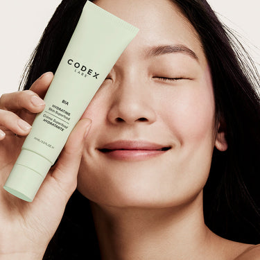 Image of woman holding Bia Skin Superfood Moisturizer.